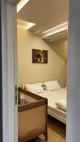 a bedroom with a bed and a mirror at The Urban Nest Central Skopje Cozy 2BR Ap in Skopje