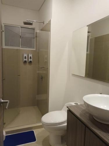 a bathroom with a shower and a toilet and a sink at APARTAMENTO VISTA AL MAR WIND 906 in Gaira