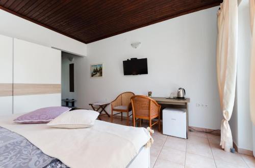 Ένα ή περισσότερα κρεβάτια σε δωμάτιο στο Apartments and Rooms PREKA