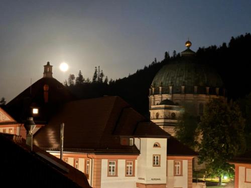 a building with a domed roof with a moon in the sky at Domview Apartment in St. Blasien