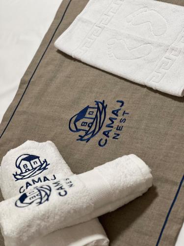 a pile of towels sitting on top of a table at Camaj Nest in Gjirokastër