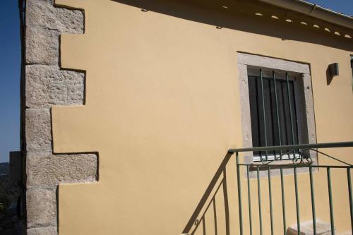 a staircase on the side of a building with a window at Casabella in Arkadádes