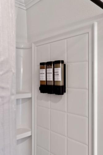 two bottles of essential oils in a closet at Sandpiper Cove 8140 - 500 Feet to the Beach! Pool in the Back Yard! in Destin