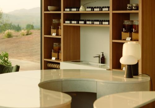 a kitchen with a white table and a sink at Season Hill Khao Yai in Ban Nong Song Hong