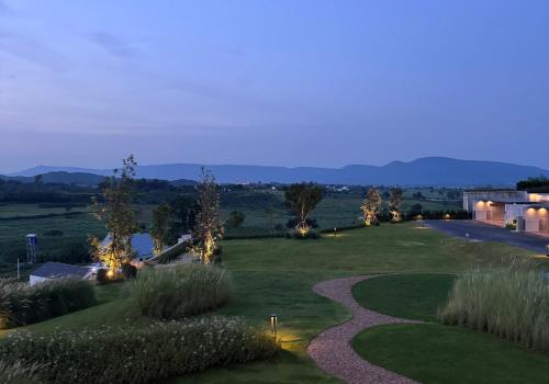 a view of a golf course at night at Season Hill Khao Yai in Ban Nong Song Hong