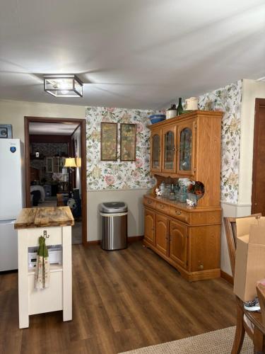 a kitchen with wooden cabinets and a refrigerator at Sonnys place in Washington