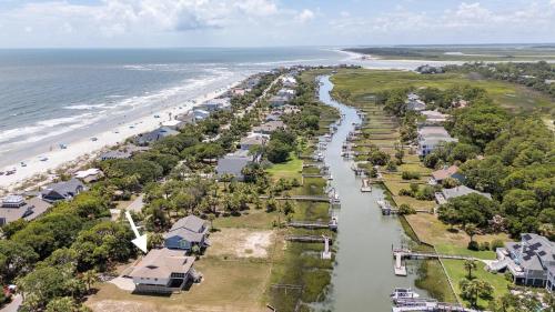 an aerial view of a beach with houses at Coastal Charm with Canal Views - 419 Tarpon Blvd, Fripp Island in Fripp Island