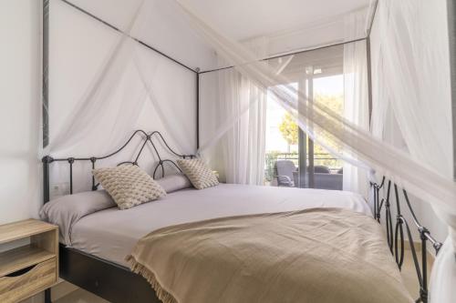 En eller flere senge i et værelse på Garrucha Playa Piscina Wifi Parking Gratis