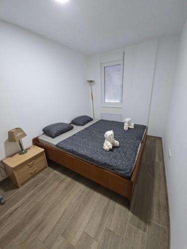Postel nebo postele na pokoji v ubytování Apartman Una