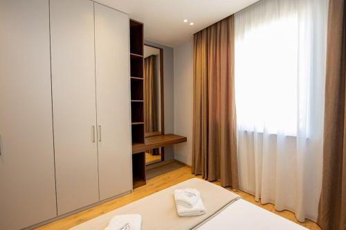 Säng eller sängar i ett rum på Infinity Apartment