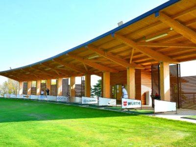 a large building with a large green lawn in front of it at Villa Francesca B&B in Grumello del Monte