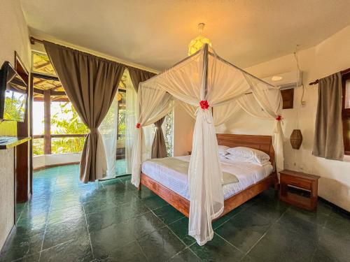 Katil atau katil-katil dalam bilik di AZORAI - Refúgio Exclusivo para até 27 Pessoas com Piscina Vista Mar e Hidromassagem