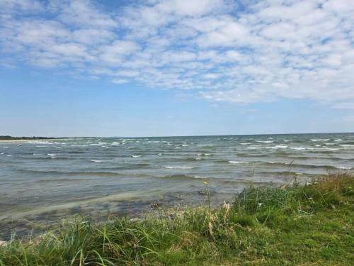 a view of the ocean from the shore of a beach at 6 person holiday home in Hadsund-By Traum in Hadsund