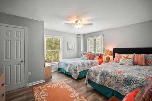 a bedroom with two beds and a window at Distinctive Island Living - 835 Bonito Rd, Fripp Island in Fripp Island