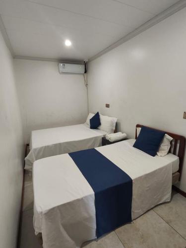 a room with two beds in a room at Alice 3-bedroom luxury apartment in Nadi