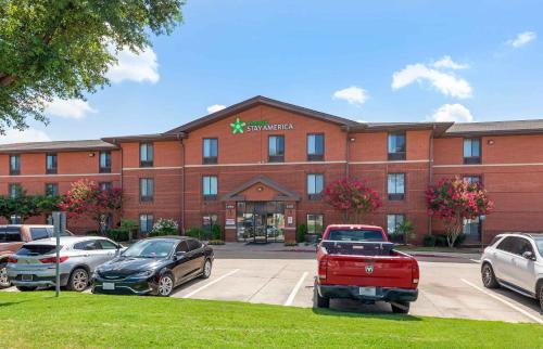 a hospital building with cars parked in front of it at Extended Stay America Suites - Arlington - Six Flags in Arlington