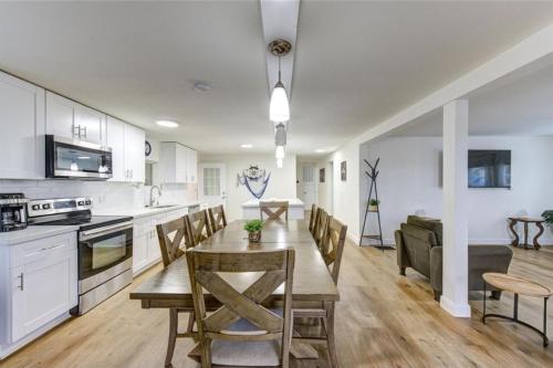 a kitchen and dining room with a table and chairs at Palms Getaway in Freeport