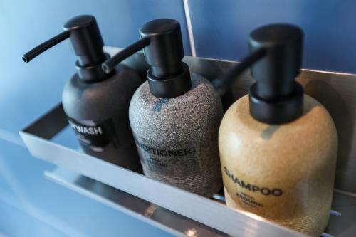 a group of three wine bottles in a drawer at Hotelaround Sokcho in Sokcho