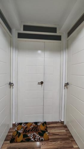 a room with a door with a bed on the floor at Mamre Guest House Tacna - Hospedaje in Tacna