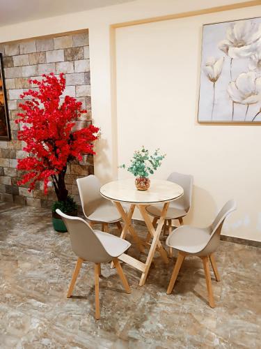 a dining room with a table and chairs at Mamre Guest House Tacna - Hospedaje in Tacna