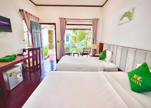 Voodi või voodid majutusasutuse Santa Resort Phú Quốc toas