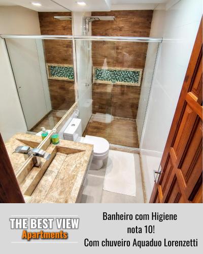 a bathroom with a shower with a toilet and a sink at The Best View in Angra dos Reis