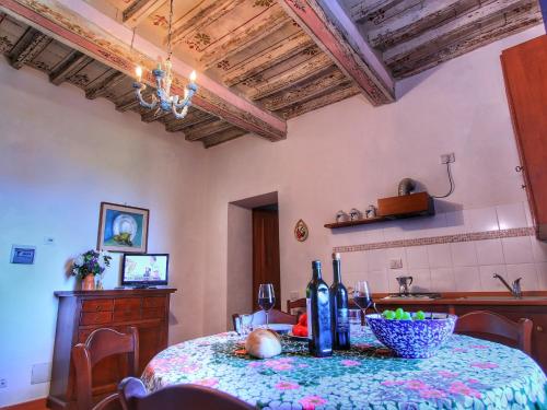 a kitchen with a table with a bowl of food on it at Farmhouse with Pool – Pets Welcome! in Gualdo Cattaneo
