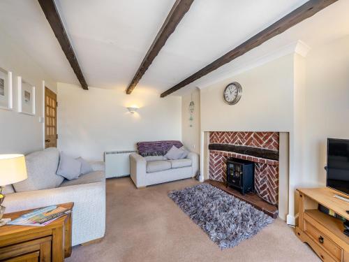 TV a/nebo společenská místnost v ubytování Quay Cottage