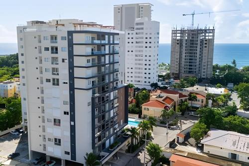 an aerial view of a city with buildings at Caribbean Sunset Soak In Juan Dolio Beach Apt. in Juan Dolio