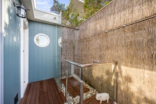 a bathroom with a walk in shower next to a wall at Epic Rye Penthouse with Bubble Dome & Amazing Views! in Rye