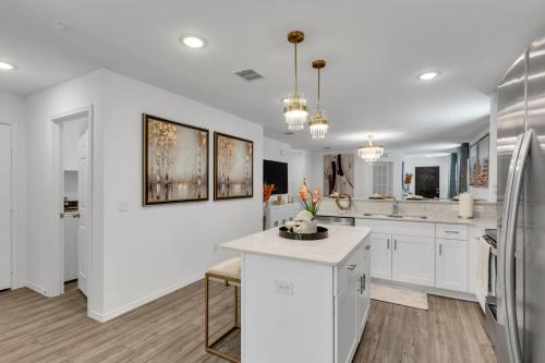 a kitchen with white cabinets and a refrigerator at Lakemeadow in Princeton