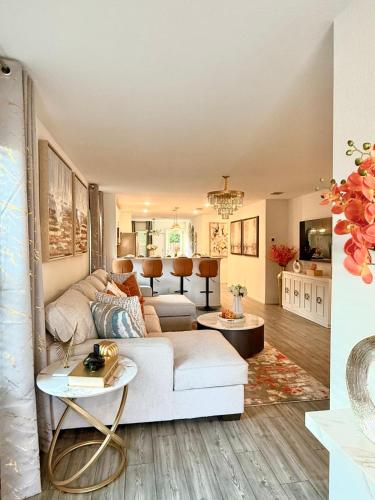 a living room with a white couch and a table at Lakemeadow in Princeton