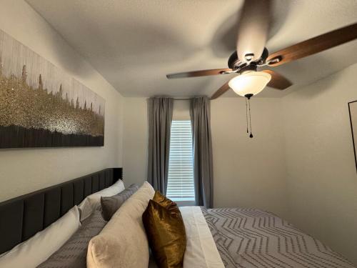 a bedroom with a ceiling fan and a bed at Lakemeadow in Princeton