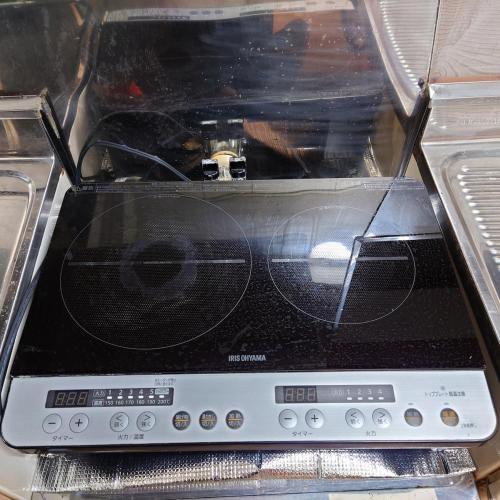 a toaster oven with its door open in a refrigerator at 熱川ヒュッテ in Higashiizu