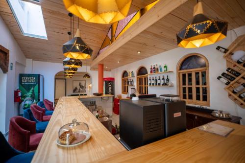 a kitchen with a long counter in a room at San Sebastian Hotel Boutique in Huaraz