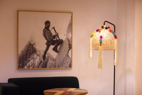 a picture of a man with a gun on a wall at San Sebastian Hotel Boutique in Huaraz
