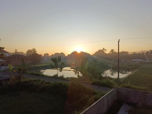 Solopgangen eller solnedgangen set fra feriehuset