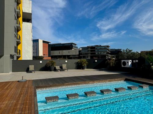 a swimming pool on the side of a building at The Gateway Getaway in Durban