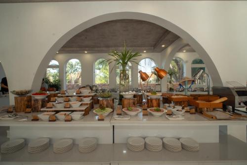 a room filled with lots of pots and bowls at The Up Hotel Phu Quoc Island - The Poolside Escape in Phu Quoc