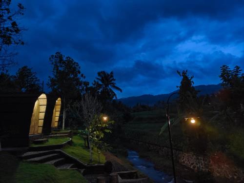 a view of a river at night at Tranquil Riverside Camping in Ambengan