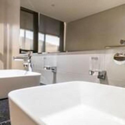 a bathroom with a white sink and a mirror at Hotel Haus in Gapyeong