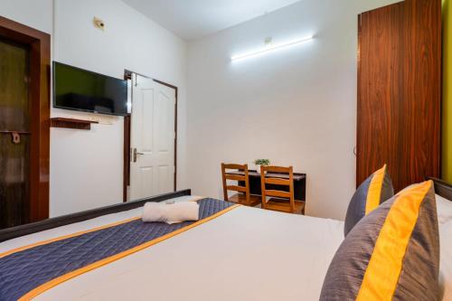 Katil atau katil-katil dalam bilik di Holiday Homes Aluva