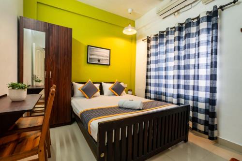 Katil atau katil-katil dalam bilik di Holiday Homes Aluva