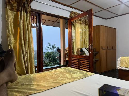 Postel nebo postele na pokoji v ubytování Babarakanda holiday resort