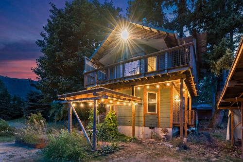 a house lit up at night with lights at The Cascade Cabin in Maple Falls
