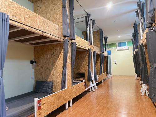 a row of bunk beds in a room at Khaosok Jungle Hostel Branch 2 in Khao Sok