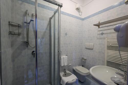 a bathroom with a shower and a toilet and a sink at Hotel Residence - Parco Mare Monte in Casamicciola Terme