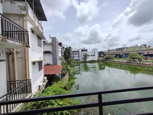 a view of a river from a balcony at Queens INN in Kodungallūr