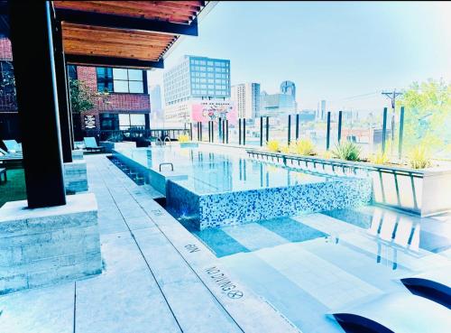a swimming pool in the middle of a building at Deep Ellum Theatre Suite - The Black Collection in Dallas