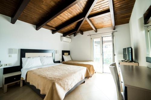 Кровать или кровати в номере Hotel Dellis